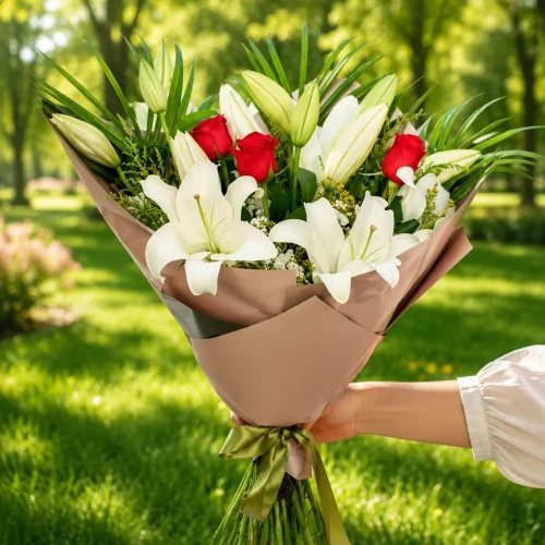 Bouquet of red roses and lilies